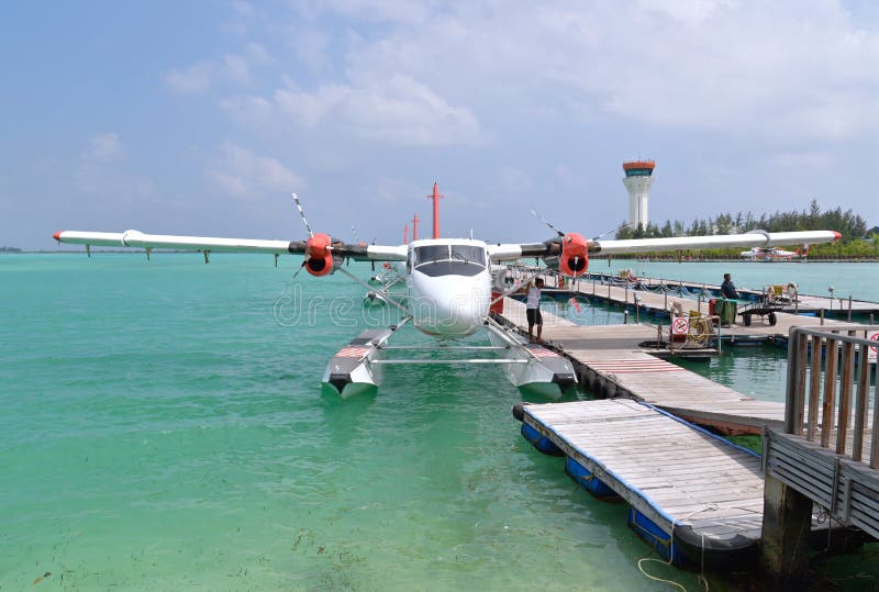 Male, Maldives - February 1, 2016: Seaplanes are waiting for passengers to board at Male, Maldives. Male, Maldives - February 1, 2016: Seaplanes are waiting for passengers to board at Male, Maldives