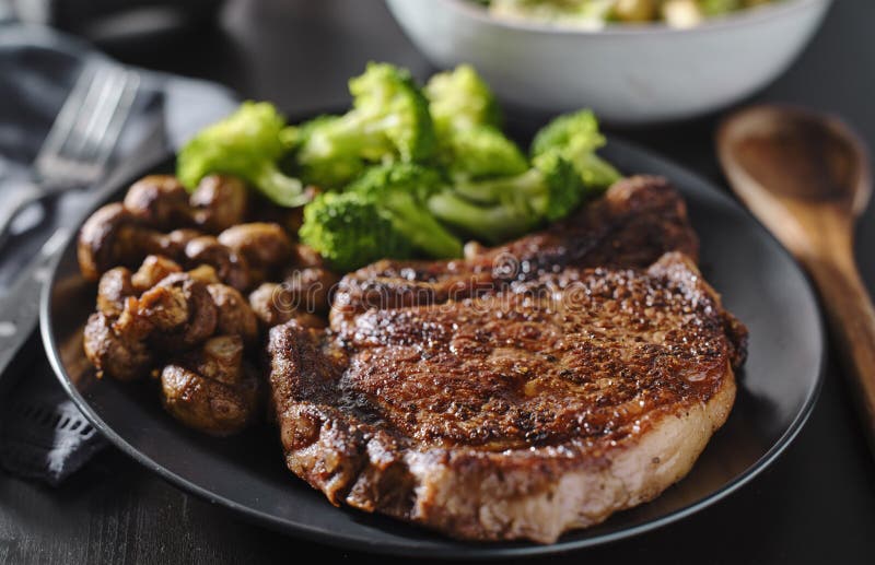 Seared Ribeye Steak with Broccoli and Sauteed Mushrooms Stock Photo Image of mushrooms