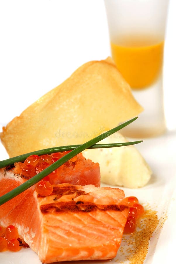 Seared salmon with pumpkin soup and caviar