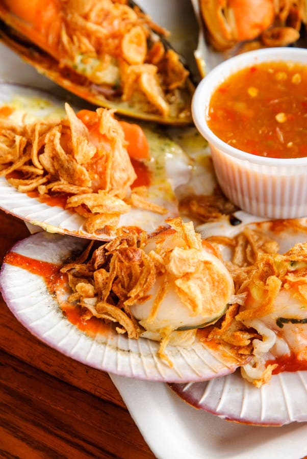 Seared Scallops and Mussels with Spicy Seafood Sauce Stock Image