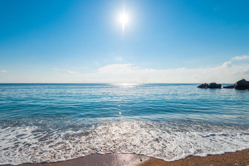The seascape is a bright midday sun over clear sea water