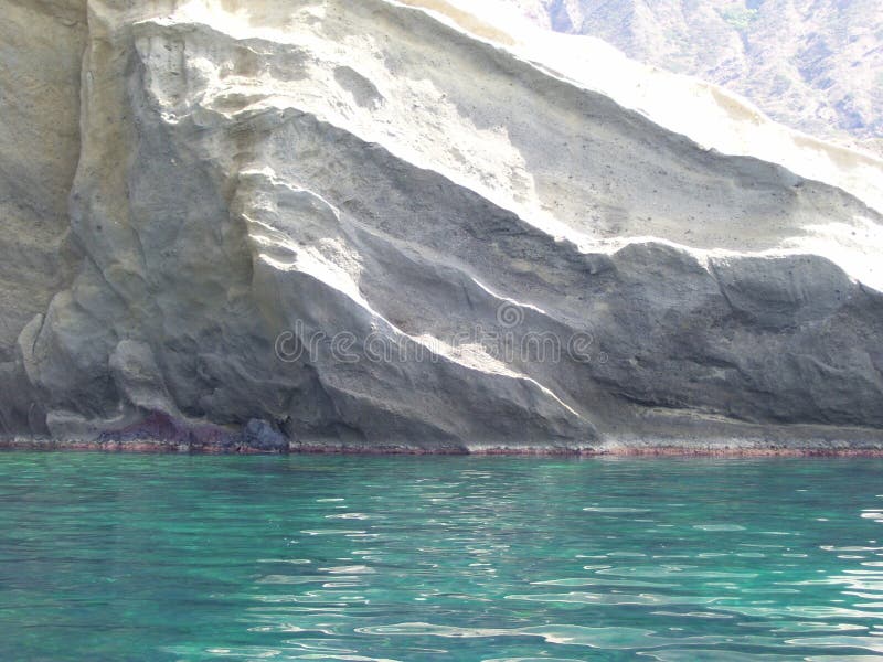 White rocks and green sea in Salina Island, Sicily, Italy, June 2010