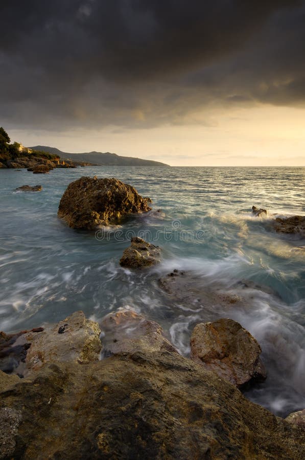 Image shows a rocky seascape near the city of Kalamata, Greece, during a windy afternoon. Roughness stock images, royalty-free photos and pictures