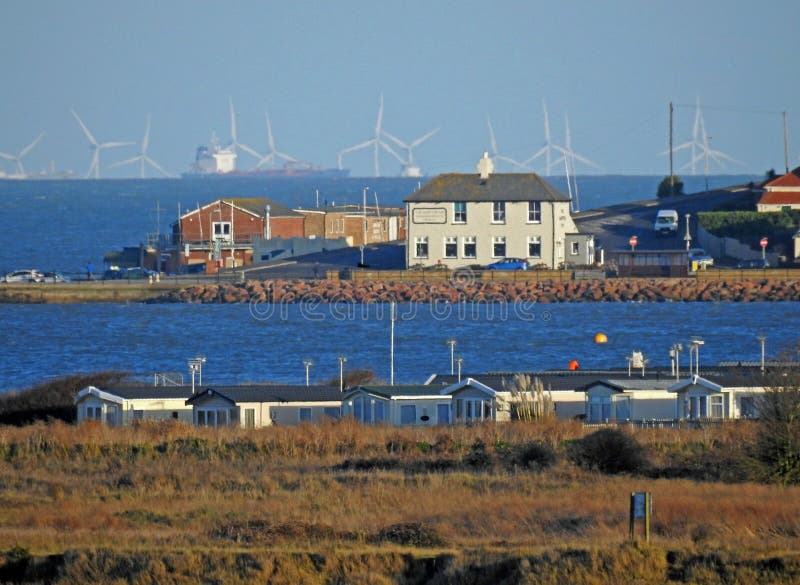 Photo of holiday seaside resort of whitstable kent with view of hampton pier and windfarm turbines on horizon nov 2017. Photo of holiday seaside resort of whitstable kent with view of hampton pier and windfarm turbines on horizon nov 2017.