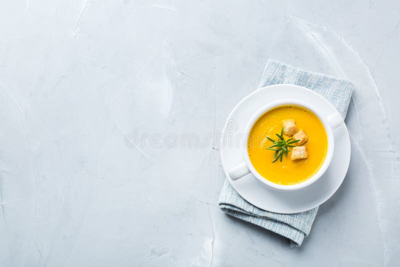 Seasonal spicy fall autumn creamy pumpkin and carrot soup.