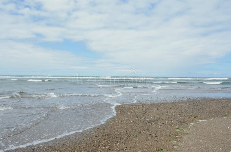 A seasonal vista on Siletz Bay Beach and north pacific ocean, along the scenic Oregon central coast. A seasonal vista on Siletz Bay Beach and north pacific ocean, along the scenic Oregon central coast