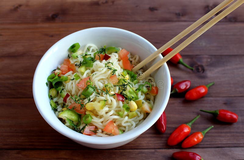 Seasoned noodles on a plate with chopsticks