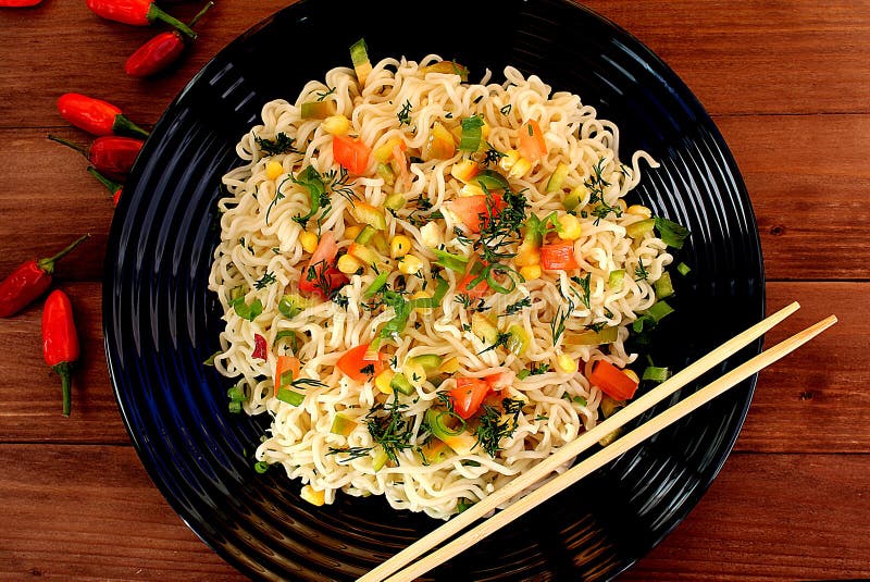 Seasoned noodles on a plate with chopsticks