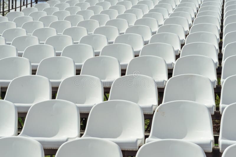 Tribune sports stadium with empty chairs Stock Photo - Alamy