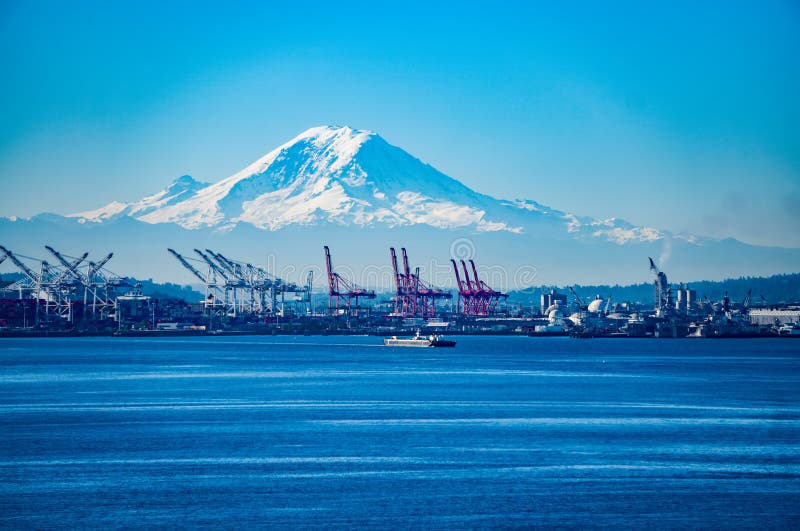Seattle Port with Red Cranes and Boats with Mt Rainier royalty free stock photo Seattle Port with Red Cranes and Boats with Mt Rainier royalty free stock photo