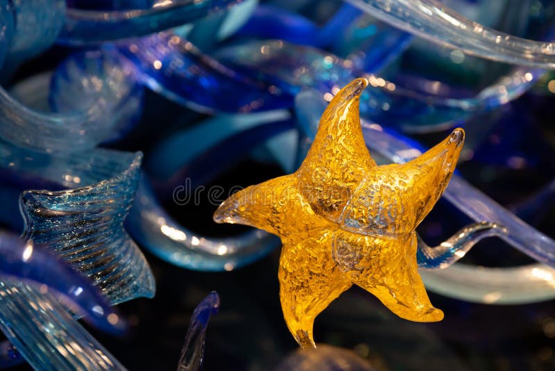 Seattle, Washington - 10.02.2018: Chihuly Garden and glass exhibition. Golden star, closeup element of Sealife Tower sculpture royalty free stock photography Seattle, Washington - 10.02.2018: Chihuly Garden and glass exhibition. Golden star, closeup element of Sealife Tower sculpture royalty free stock photography