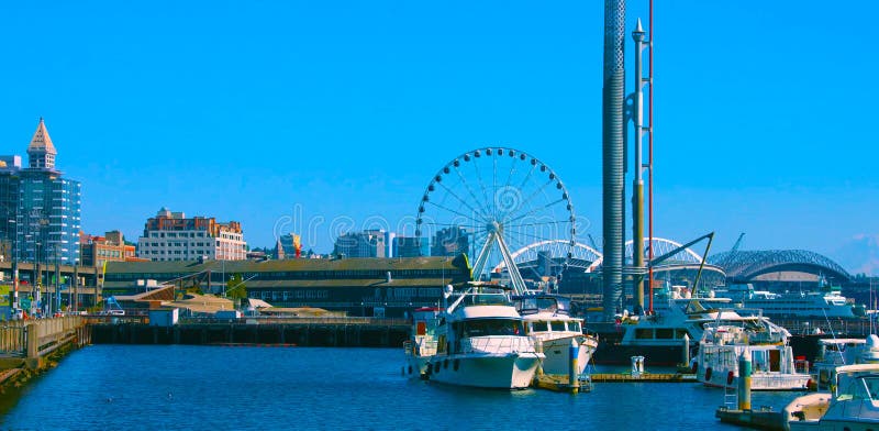 Seattle, Washington, USA mai 5, 2019 Great wheel on Pier 58 during the golden hour before sunset, Alaskan Way, Downtown,Tourist boat skipping , Seattle, Washington, USA, North America. Seattle, Washington, USA mai 5, 2019 Great wheel on Pier 58 during the golden hour before sunset, Alaskan Way, Downtown,Tourist boat skipping , Seattle, Washington, USA, North America.