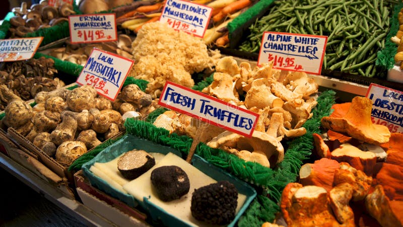 SEATTLE WASHINGTON USA - October 2014 - Mushrooms and truffles for sale in the high stalls at the Pike Place Market. stock photo SEATTLE WASHINGTON USA - October 2014 - Mushrooms and truffles for sale in the high stalls at the Pike Place Market. stock photo