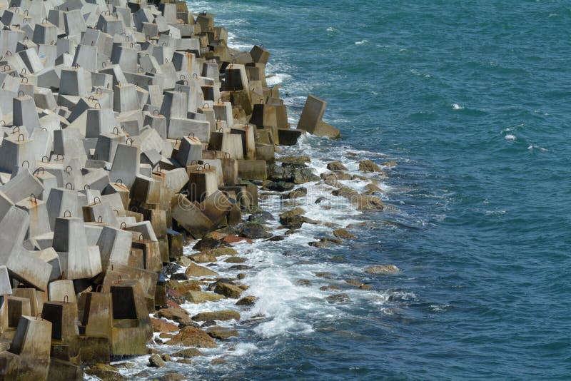 Seawall and ocean waves aerial view