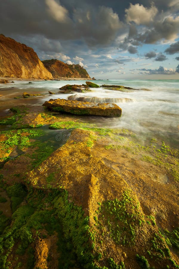 Sunset seascape with heavy clouds royalty free stock photo