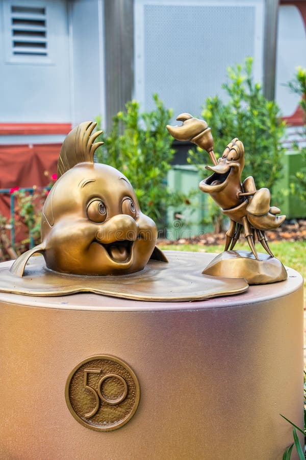 Sebastian and Flounder Gold Statue 50th Anniversary Disney Editorial