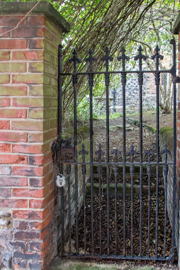 Secret Garden Pathway. Iron Gate with Padlock at Walled Garden Entrance