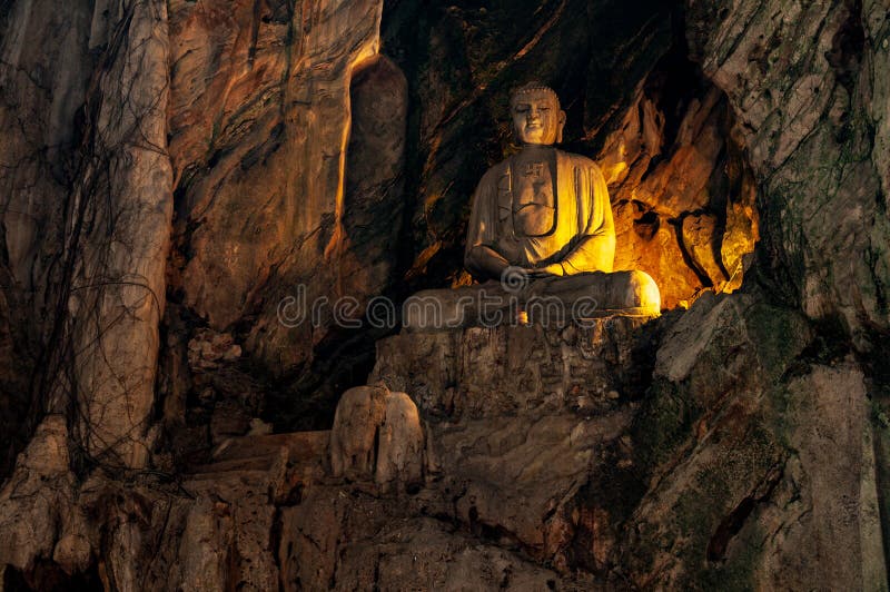 Buddha Statue at secret underground cave temple in Marble Mountains, Da Nang, Vietnam