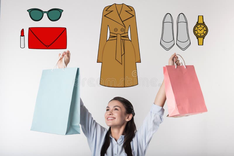 Secretaria emocional que siente feliz mientras que compra viste para el trabajo fotografía de archivo Secretaria emocional que siente feliz mientras que compra viste para el trabajo fotografía de archivo