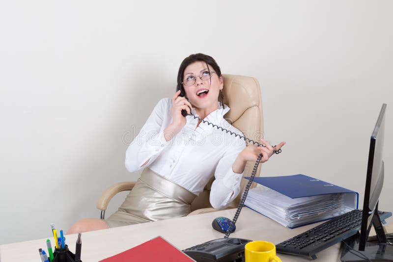 Secretary talking on the phone stock photo