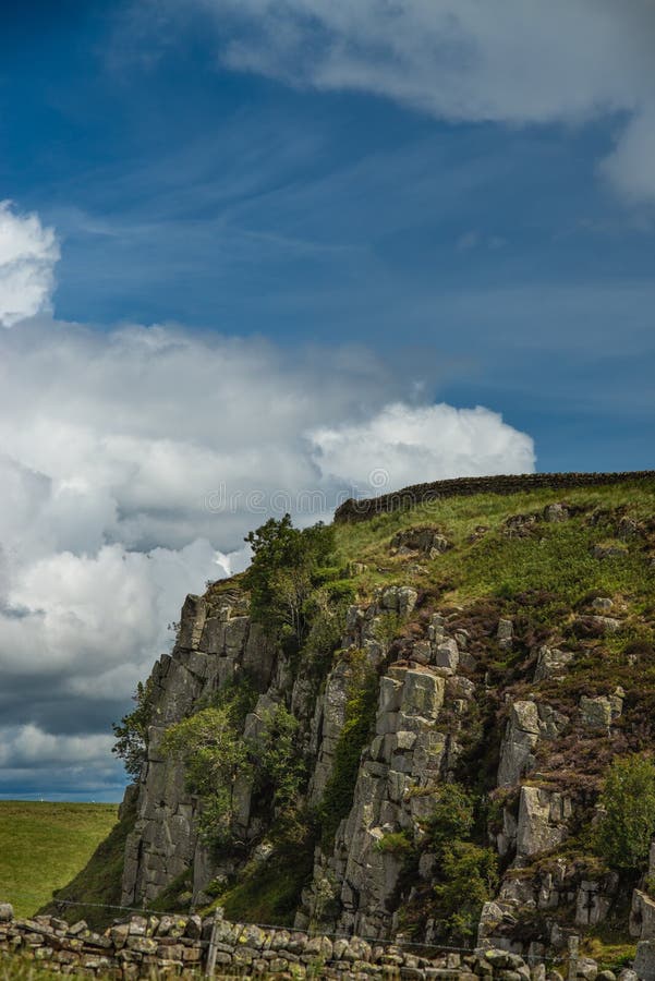 A Segment of Hadrian`s Wall On Top of Dramatic Cliffs in Northumberland. A Segment of Hadrian`s Wall On Top of Dramatic Cliffs in Northumberland