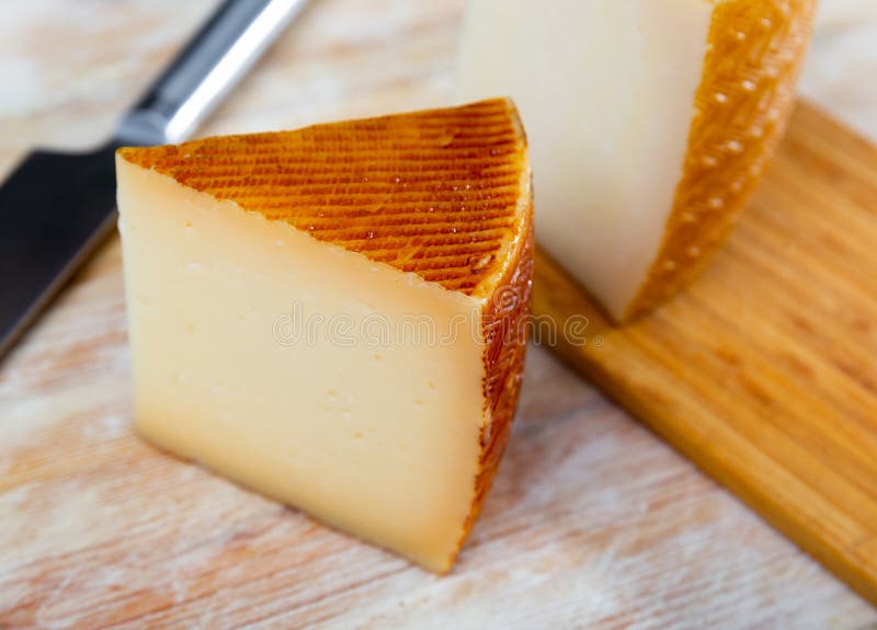 Sector of Spanish Cheese on Wood Surface Stock Image Image of