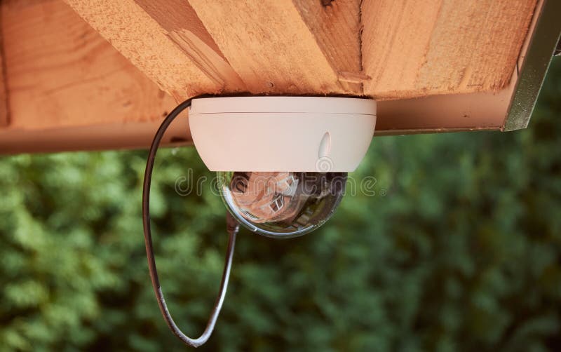 The Security Camera is Attached To the House. CCTV Camera Mounted on