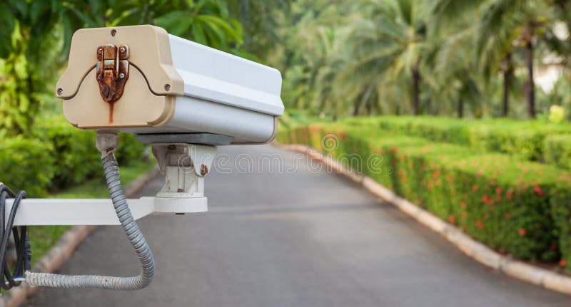 Security camera, CCTV hangs in garden for surveillance. Old cctv monitor stock images, royalty-free photos and pictures