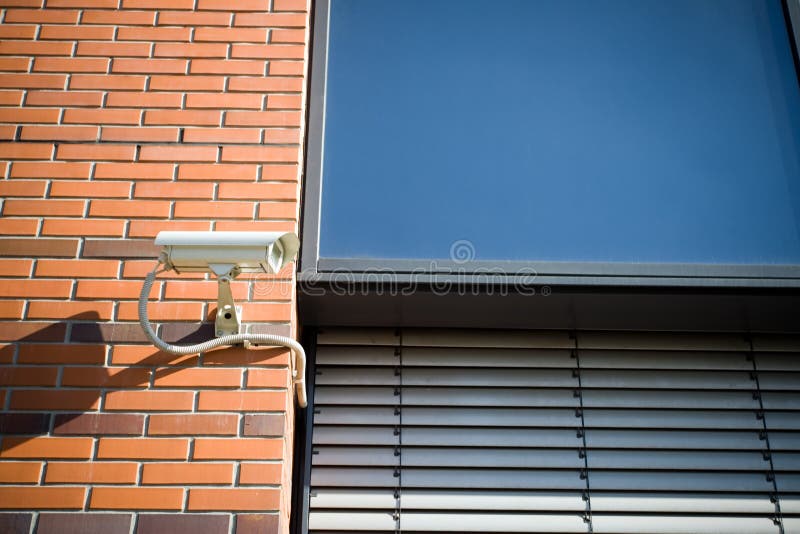 Security camera on modern building facade