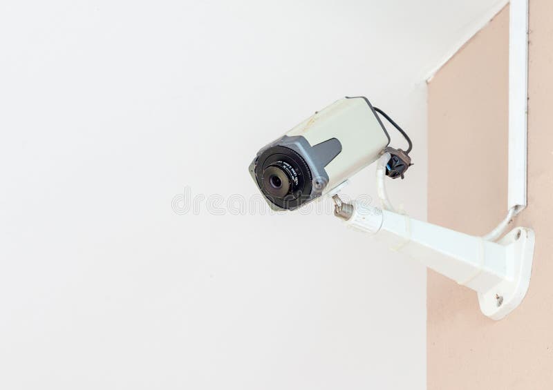 Security camera, old CCTV on the orange cement wall. Old cctv monitor stock images, royalty-free photos and pictures