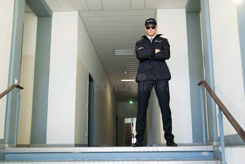 Security Guard Standing At The Entrance stock photo
