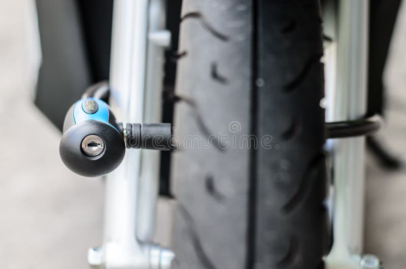 Security Lock Blocking the Motorcycle Front Wheel Stock Photo Image