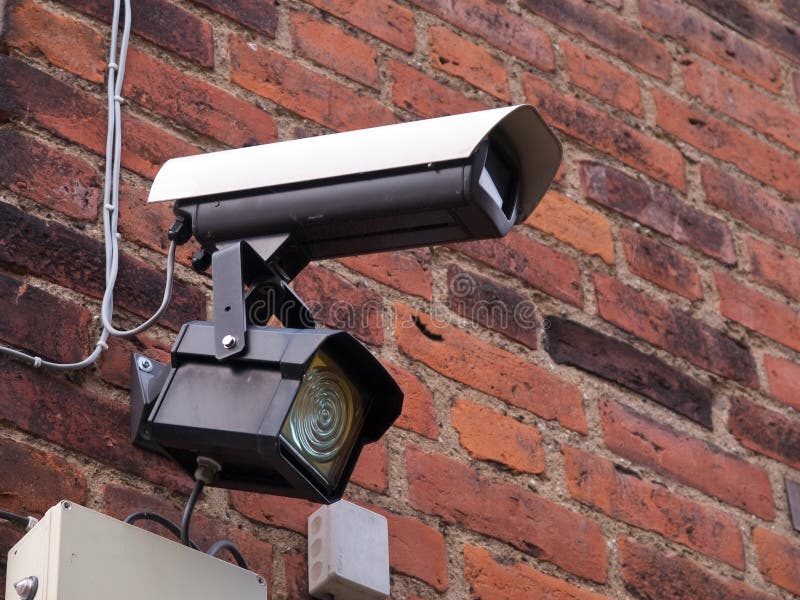 Security surveillance camera on a building corner