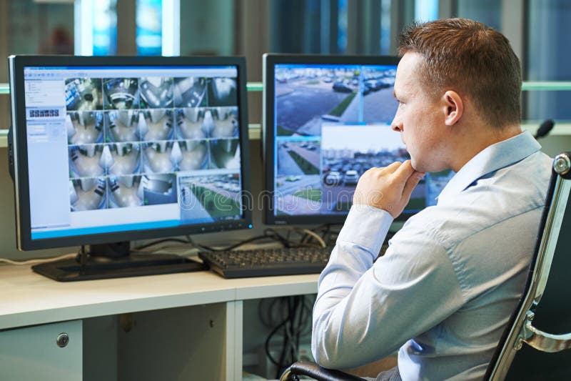 Security worker during monitoring. Video surveillance system.