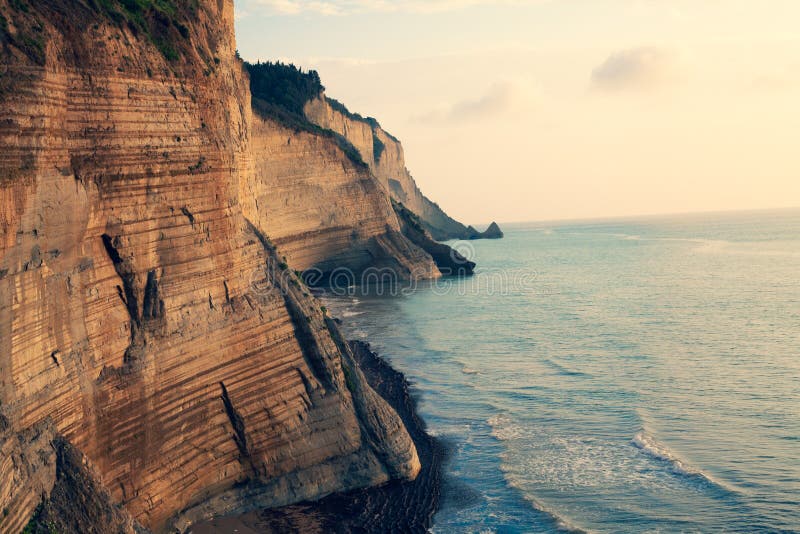 Sedimentary Rock Cliff at the sea, Limestone Natural Structure Coast, Mointain Chain of Layered Stone Formation along the Beach, H