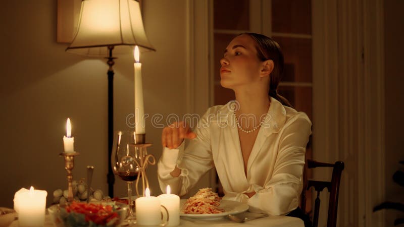 Seductive woman waiting at romantic dinner closeup. Sexy lady sitting alone