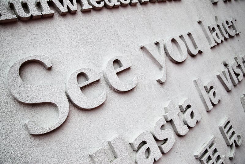 Board with leave-takings in different languages close up. Roughness stock images, royalty-free photos and pictures