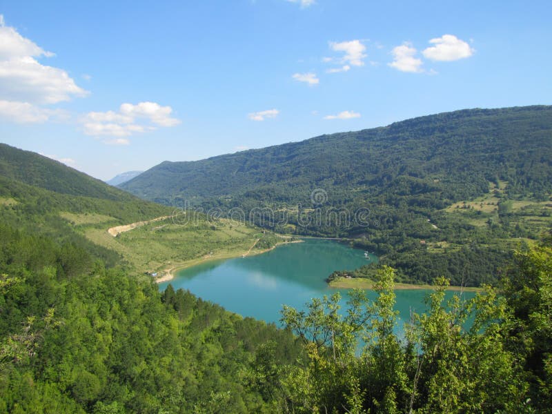Lake Zavoj in southeast Serbia with one part of Old mountain (Stara planina). Beautiful view from one side. Lake Zavoj in southeast Serbia with one part of Old mountain (Stara planina). Beautiful view from one side.