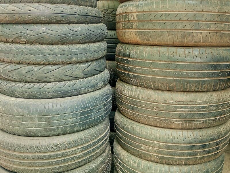 Seen Some Used Car and Motorcycle Tires Arranged in Two Rows Stock