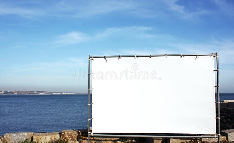 Canvas panel for outdoor advertising with blue sky and sea as background. Canvas panel for outdoor advertising with blue sky and sea as background