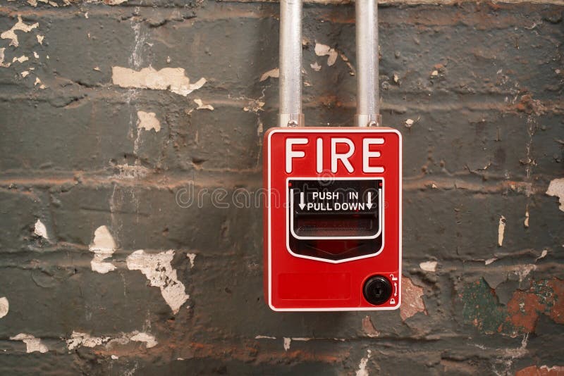 Fire alarm on old brick wall background. Fire alarm on old brick wall background