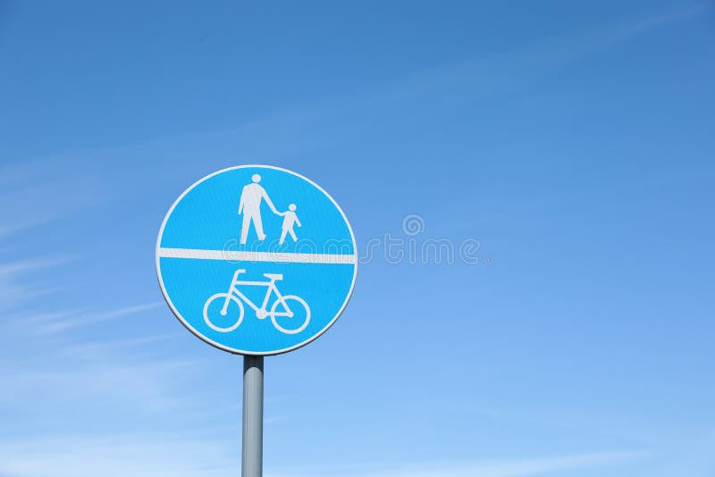 Traffic sign Compulsory Track For Pedestrians and Bicycles against sky. Traffic sign Compulsory Track For Pedestrians and Bicycles against sky