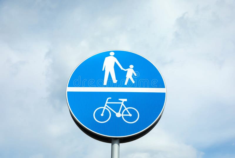 Traffic sign Compulsory Track For Pedestrians and Bicycles against sky. Traffic sign Compulsory Track For Pedestrians and Bicycles against sky