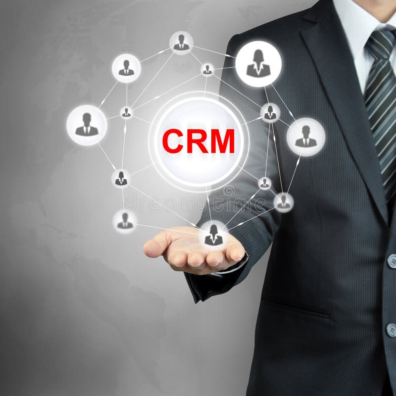 Segno di CRM (customer relationship management) indicato da un uomo d'affari immagine stock Segno di CRM (customer relationship management) indicato da un uomo d'affari immagine stock