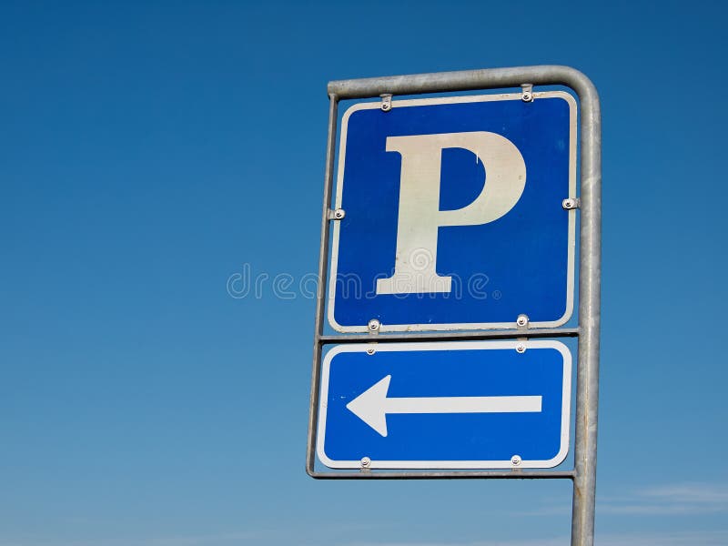 Parking symbol sign with direction arrow with clear blue sky background. Parking symbol sign with direction arrow with clear blue sky background