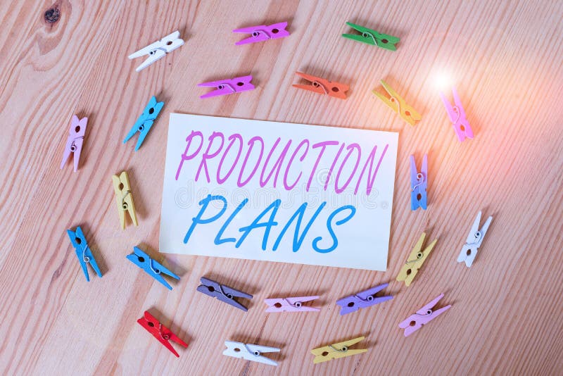 Text sign showing Production Plans. Business photo showcasing deciding how to go about producing a particular product Colored clothespin papers empty reminder wooden floor background office. Text sign showing Production Plans. Business photo showcasing deciding how to go about producing a particular product Colored clothespin papers empty reminder wooden floor background office