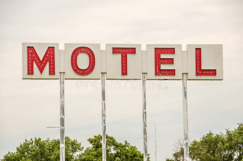 Generic motel sign in the USA with red letters on a white background. Generic motel sign in the USA with red letters on a white background