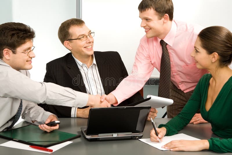 Business people making a successful deal with the partners. Business people making a successful deal with the partners