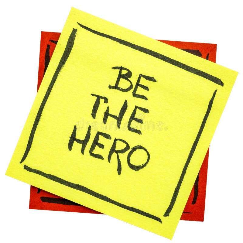 Be the hero - handwriting on an isolated sticky note. Be the hero - handwriting on an isolated sticky note