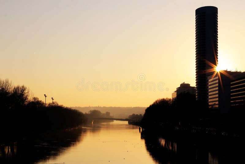 Seine River in Puteaux and Puteaux island at sunset near La defense. From pont de Neuilly.